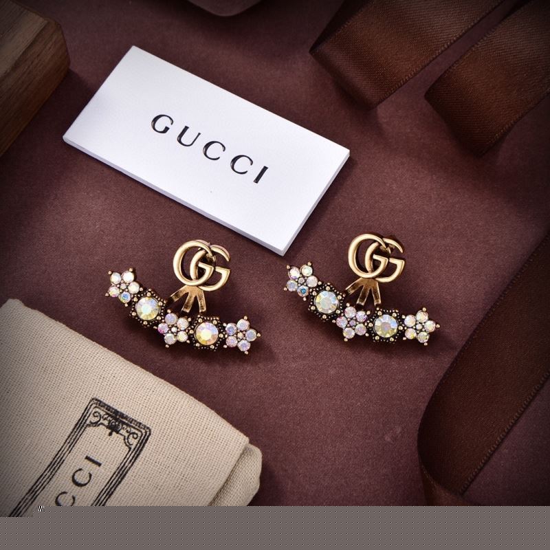 G*u*i earrings